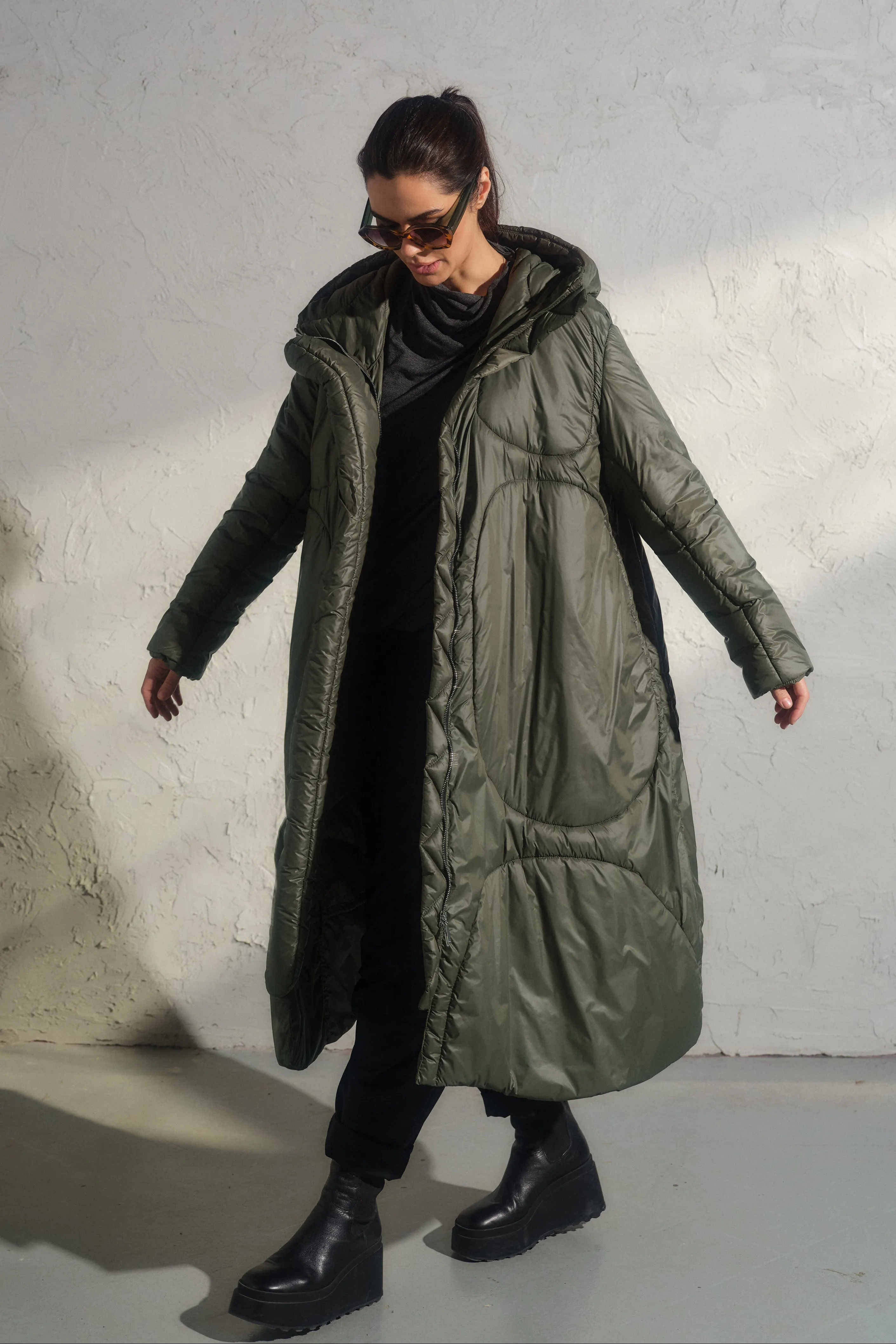 Avant garde transitional puffer jacket with hood