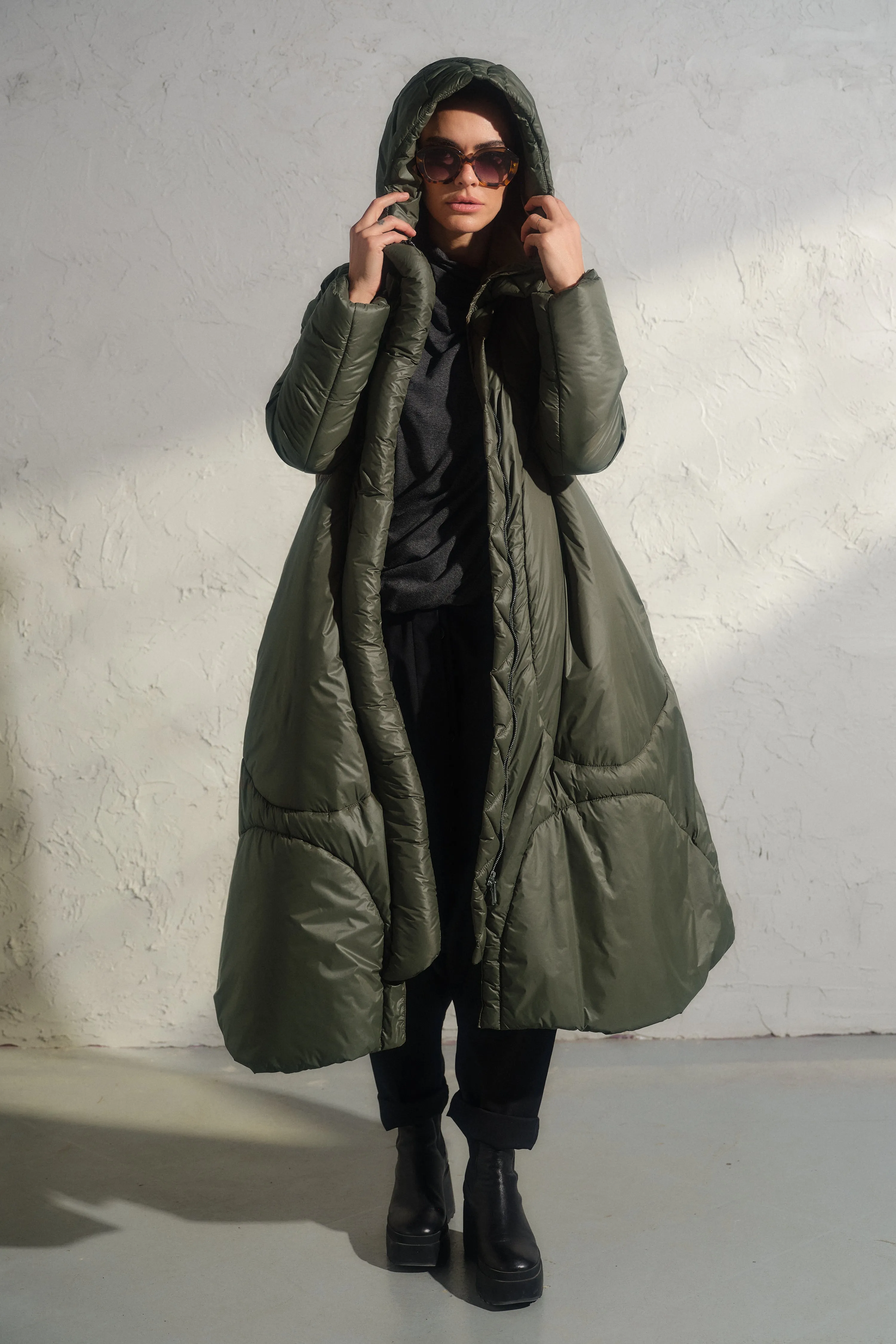 Avant garde transitional puffer jacket with hood